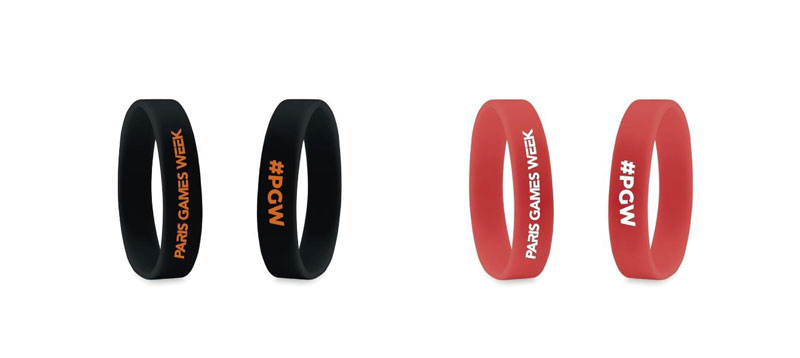 Red and black wristbands with the Paris Games Week Next Level logo